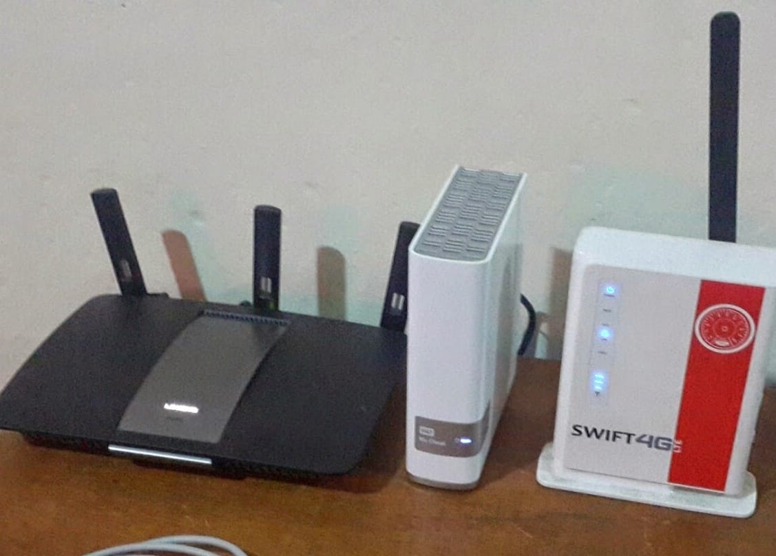 My Lynksys router, sitting alongside my 4TB WD NAS and my ISP's modem
